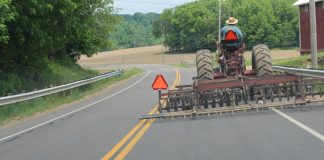 7 safety tips for driving farm equipment on the road tractor on the road