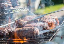 Grilling, Smoking, or Barbecuing: Is there a difference? Grill loaded with burgers
