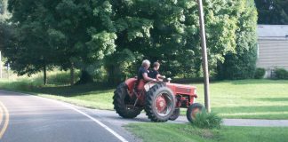 Two riders on tractor