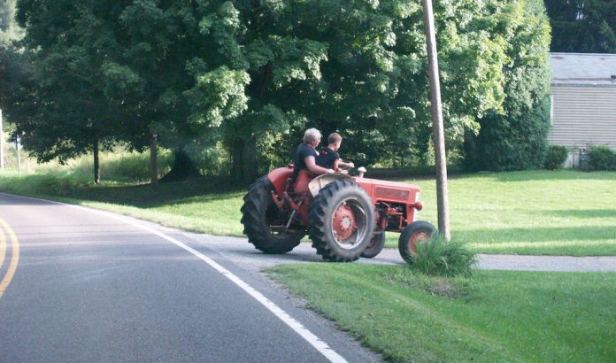 Two riders on tractor