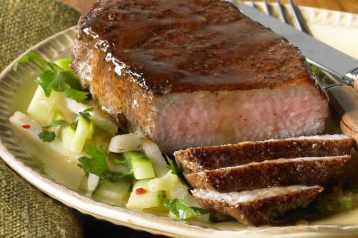 Chinese Five Spice & Maple Glazed Pork Chops Chinese Five Spice & Maple Glazed Pork Chop on a plate with chopped broccoli.