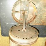 Can you name this Hazard a Guess Tool Submission? Richard Bader, of Middletown, New York, picked up Item No. 1125 at a yard sale. It is 9 inches in diameter, 6 1/2 inches in height when closed and weighs 12 pounds. There is a lever on the side that you can move to any hole on the disk. The peg on top has a handle and moves back and forth.