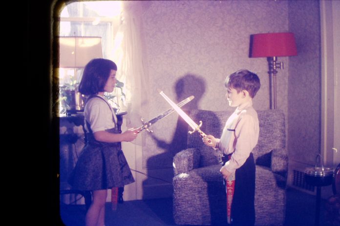 Kym Seabolt in a childhood sword fight.