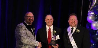 Tom Stoller accepts award