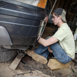Lean on family and faith “when the wheels come off” BoyWonder repairing his vehicle