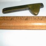 Can you name this golden-hued antique tool?