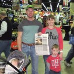 Visiting the National Farm Machinery Show with the Hays family The Hays family stands with their Farm and Dairy Newspaper at the National Farm Machinery Show