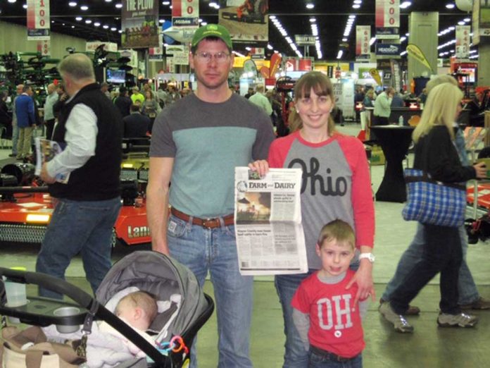 Vacation with Us: The Hays Family The Hays family stands with their Farm and Dairy Newspaper at the National Farm Machinery Show