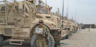 Maj. Mark Stepuk in Afghanistan with his Farm and Dairy newspaper
