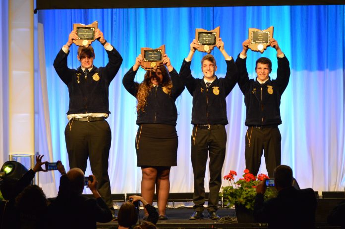 The FFA’ers who earned state Star awards, or Stars Over Ohio, celebrated following their introduction during the state convention May 2-3. Pictured (L-R) Cody Clark, Zane Trace FFA; Madison Whitt, Ridgewood FFA; Jacob Wuebker, Versailles FFA; and Montgomery Boes, Upper Sandusky FFA. (Mickayla Overholt photo.)