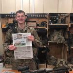 On deployment with Pfc. Sims! Pfc. Sims poses with his farm and dairy in front of his machine gun while on deployment in Afghanistan