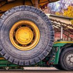 Ohio Ag Equipment buys North Central Ag wheel of a construction tractor strapped down