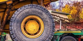 Ohio Ag Equipment buys North Central Ag wheel of a construction tractor strapped down