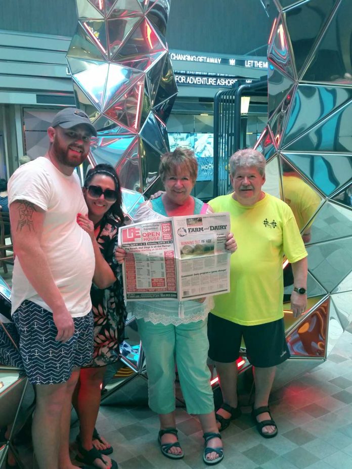 vac-keene Janet Keene (holding Farm and Dairy), Lyle Printing commercial printing sales manager, and her husband Randy, of Salem, Ohio, cruised with Janet’s daughter and son-in-law, Chris and Tema Jordan, on the Symphony of the Seas recently. The boat is the largest cruise ship in the world.