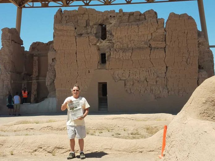 vac-salas Bill Henry stands in front of the Casa Grande Ruins holding a Farm and Dairy newspaper.