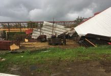 Managing hay fields and pastures when storms blow debris into them tornado damage to barn