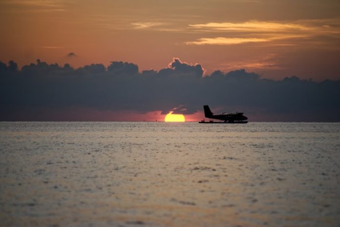 sunset over water sunset over water