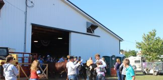 Friends and family congratulate Billy Kegley after he wins beef showman of showmen.