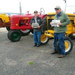 Riding antique tractors in Mackinaw City with Rufner and Moore