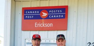 Stanley Miller and Curt Trushel standing in ftont of a building in Manitoba, Canada