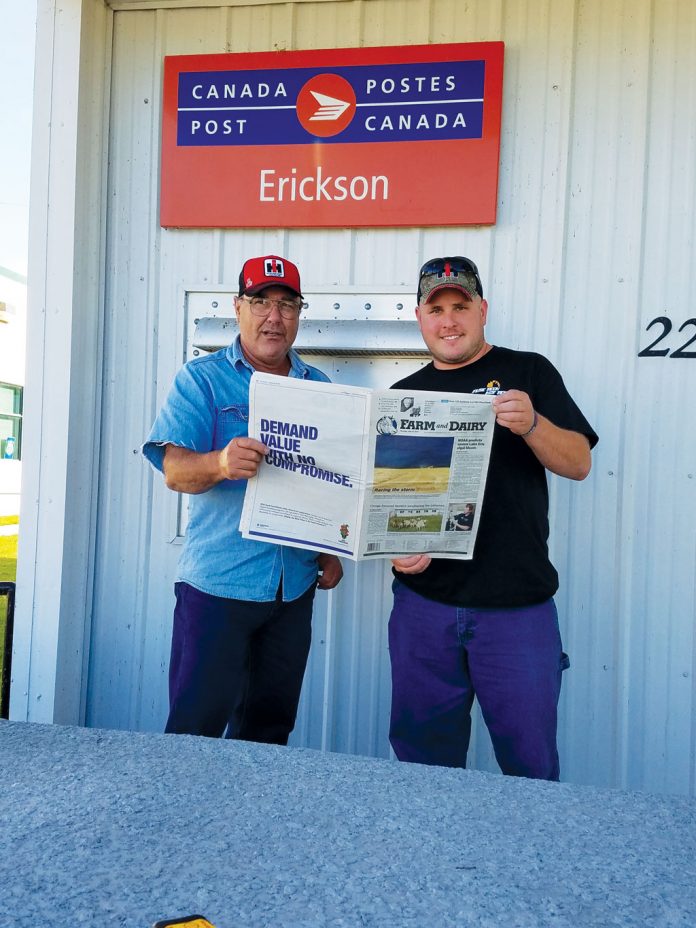 Stanley Miller and Curt Trushel standing in ftont of a building in Manitoba, Canada