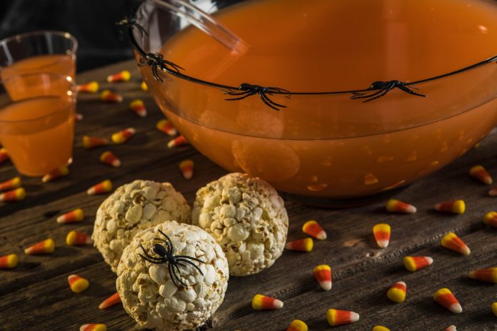 feature.web Caramel Popcorn Balls decorated for halloween with plastic spiders