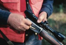 Informational meeting on March 3 for new youth rifle team hunter loading rifle orange vest