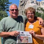 A trip to the Great American West with White and Burrier Tom White and Elizabeth Burrier stand in front of Mt. Rushmore with their Farm and Dairy newspaper in hand.