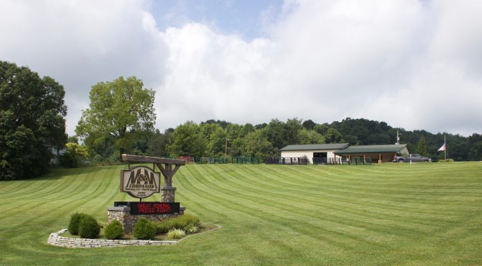 Rural businesses, professionals face limited broadband access A sign for M&M Feed Supply with the store behind it.