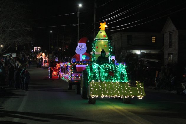 line of lighted tractors