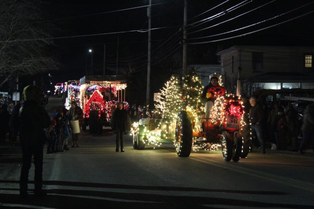 line of lighted tractors
