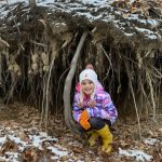 How to reduce erosion, improve habitat along a waterway Vayda squatting in front of tree roots, holding soil together along a creek bed