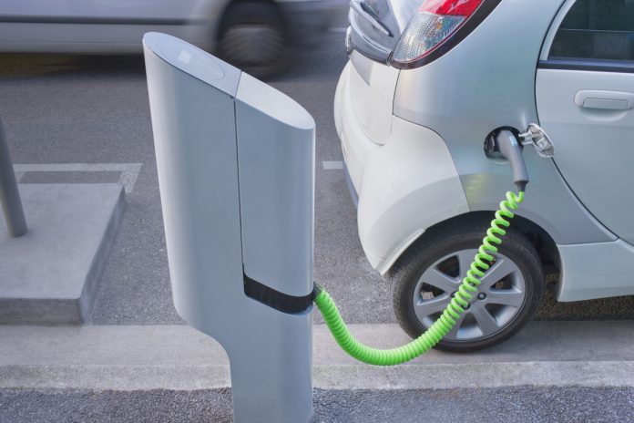 electric car plugged into a charger