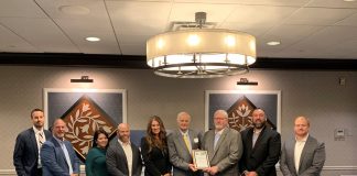 Encino Energy wins award for excellence people standing in a row accepting an award