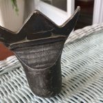 Can you take the crown and name this antique item?