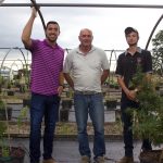 The Ohio Hemp Co. focuses on research, leadership with new crop Three men stand near hemp plants growing in pots in a hoophouse.