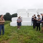 Farmers talk soil health, weather at Woodlyn Acres Farm tour A farmer addresses a group of visitors at a farm tour.