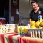 A woman sets up a concessions stand at the Canfield Fair.