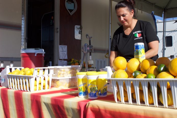 canfield_fair_1 A woman sets up a concessions stand at the Canfield Fair.