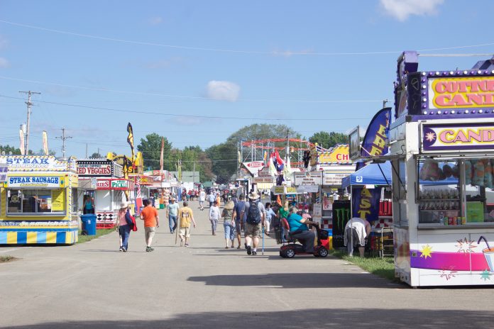 canfield_fair_2 Fairgoers walk around at the Canfield Fair.