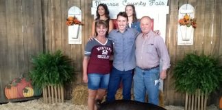 people standing with pig