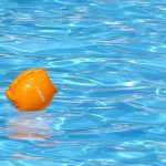 Reflecting on unique moments in time water wing in pool