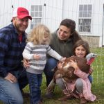 Heritage turkeys part of historical connection for Brockett Family Farm A couple and their two daughters with a turkey.