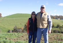 With conservation, what goes around comes around at Meadow View Farm Two people stand on a farm.