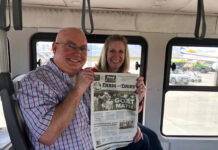 Visiting Cabo San Lucas with the Weavers Lance and Jaimye Weaver hold the Farm and Dairy on the bus in Cabo San Lucas, Mexico