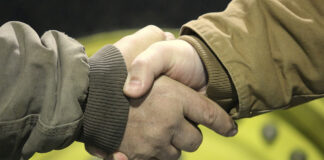 Father teaches that loyalty runs deeper than simple honesty handshake