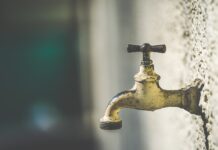 Get well educated in Geauga County brass faucet with water droplets