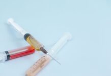 What farmers need to know about FDA guidance ending OTC antibiotics white and orange syringe on white surface
