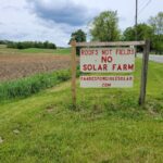 Solar debate hits western Pennsylvania farming communities a sign reading roofs not fields no solar farm sits along a road with farm fields in the background