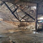 A barn with a collapsed roof.